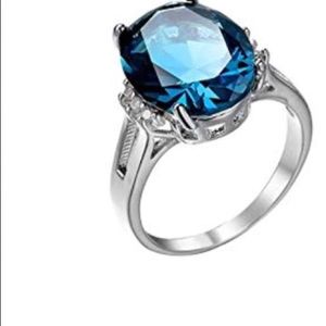 Womens fashion silvertone ring with blue stone siz